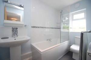 En-suite bathroom with bath and shower